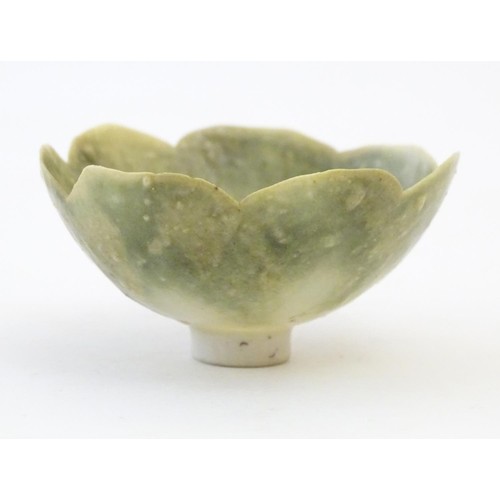 150 - An Arts & Crafts miniature footed bowl formed as a flower with petal detail. Marked with monogram un... 