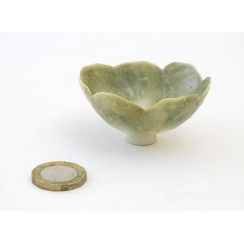 150 - An Arts & Crafts miniature footed bowl formed as a flower with petal detail. Marked with monogram un... 