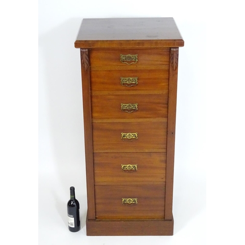 1397 - A late 19thC mahogany Wellington chest with a squared moulded top above six graduated drawers with b... 