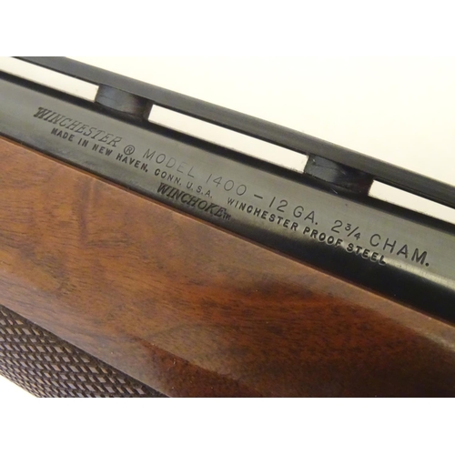 2053 - Shotgun: a Winchester 1400 12 bore semi automatic shotgun, 28 barrel with 2 3/4 chamber, wide ventil... 