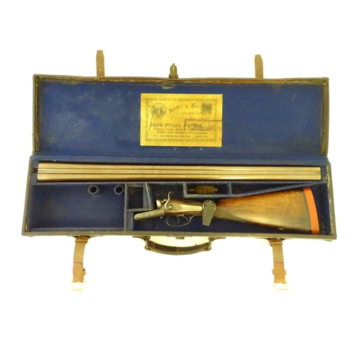 2062 - Shotgun: an Army and Navy CSL, London 12 bore sidelever back action hammergun, cased, c1880. 

30 ni... 