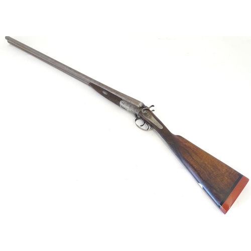 2062 - Shotgun: an Army and Navy CSL, London 12 bore sidelever back action hammergun, cased, c1880. 

30 ni... 