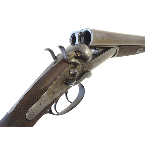 2062 - Shotgun: an Army and Navy CSL, London 12 bore sidelever back action hammergun, cased, c1880. 

30 ni... 