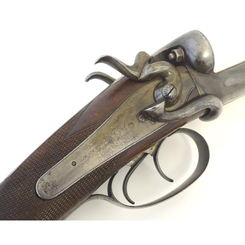 2062 - Shotgun: an Army and Navy CSL, London 12 bore sidelever back action hammergun, cased, c1880. 

30 ni... 