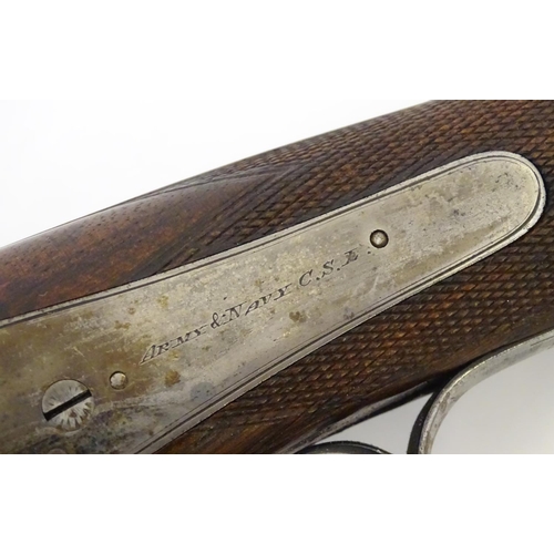 2062 - Shotgun: an Army and Navy CSL, London 12 bore sidelever back action hammergun, cased, c1880. 

30 ni... 