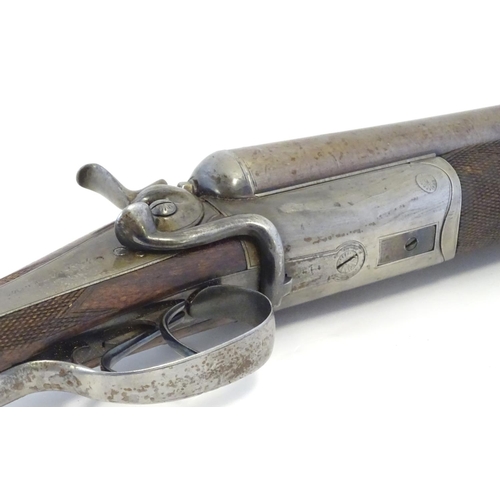 2062 - Shotgun: an Army and Navy CSL, London 12 bore sidelever back action hammergun, cased, c1880. 

30 ni... 