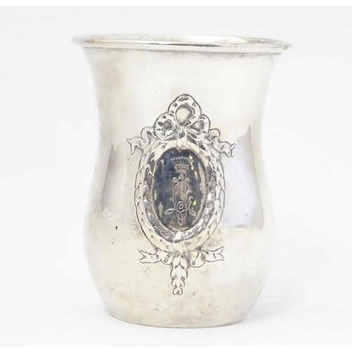 416 - A mid 19thC Austrian Empire silver beaker with laurel chaplet and bow decoration and a monogram surm... 