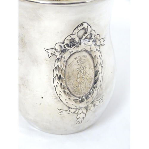 416 - A mid 19thC Austrian Empire silver beaker with laurel chaplet and bow decoration and a monogram surm... 