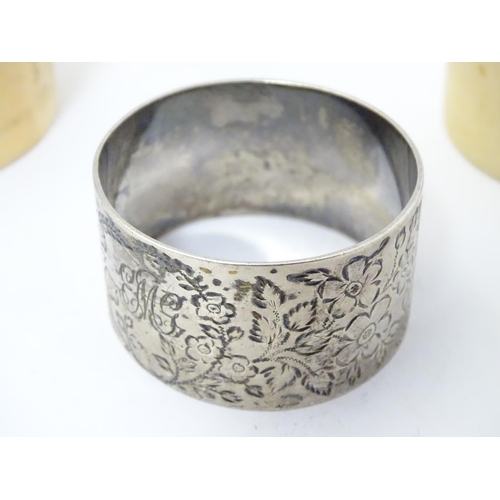 417 - A Victorian silver napkin ring decorated with a butterfly amongst flowers. Hallmarked Sheffield 1896... 