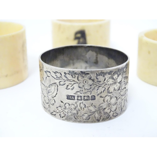 417 - A Victorian silver napkin ring decorated with a butterfly amongst flowers. Hallmarked Sheffield 1896... 