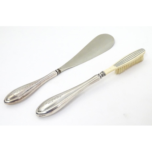 420 - American sterling silver handled shoe horn and brush. Both with maker’s mark for Watson Co. of Attle... 