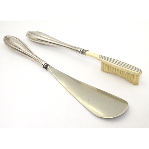 420 - American sterling silver handled shoe horn and brush. Both with maker’s mark for Watson Co. of Attle... 