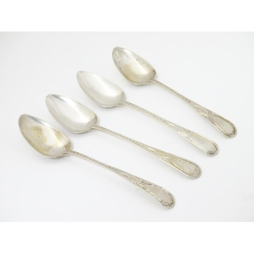 429 - A set of 4 Geo III teaspoons with bright cut decoration. Maker RF. 5