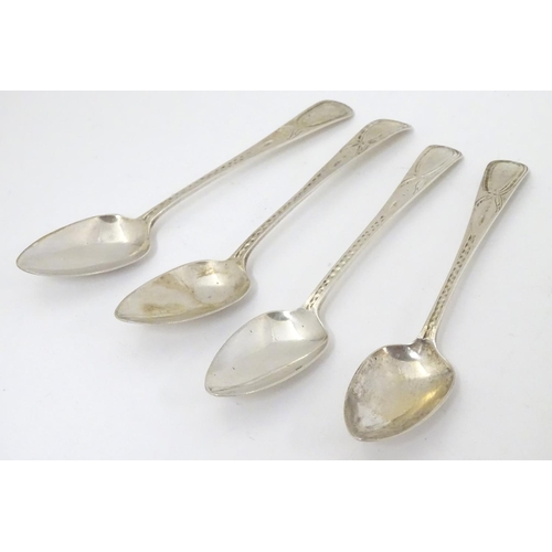 429 - A set of 4 Geo III teaspoons with bright cut decoration. Maker RF. 5