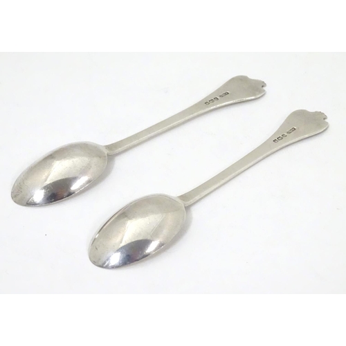 443 - A pair of silver teaspoons with dog nose style handles, hallmarked Sheffield 1933, maker C. W Fletch... 