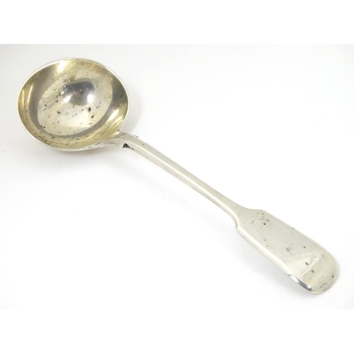 449 - A silver fiddle pattern sauce ladle, hallmarked London 1901, maker Robert Stebbings. 7 1/4