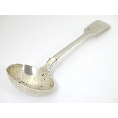 449 - A silver fiddle pattern sauce ladle, hallmarked London 1901, maker Robert Stebbings. 7 1/4