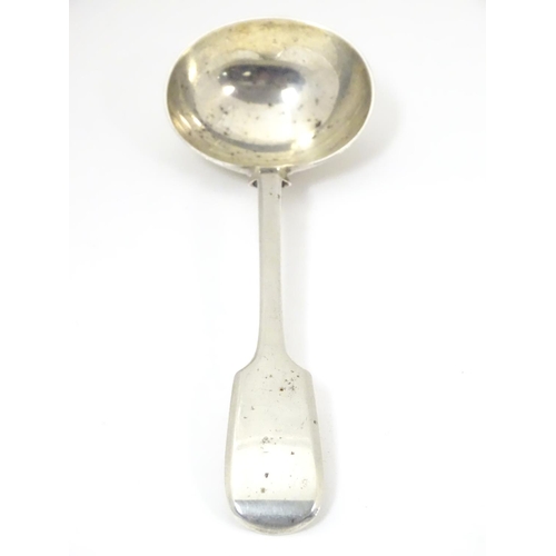 449 - A silver fiddle pattern sauce ladle, hallmarked London 1901, maker Robert Stebbings. 7 1/4