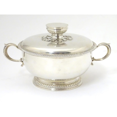 457 - A silver porringer and cover hallmarked London 1964, maker Edward Barnard & Sons Ltd. 
6 1/4