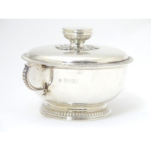 457 - A silver porringer and cover hallmarked London 1964, maker Edward Barnard & Sons Ltd. 
6 1/4