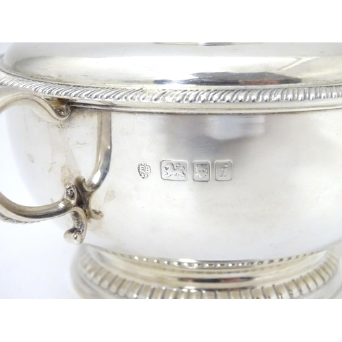 457 - A silver porringer and cover hallmarked London 1964, maker Edward Barnard & Sons Ltd. 
6 1/4