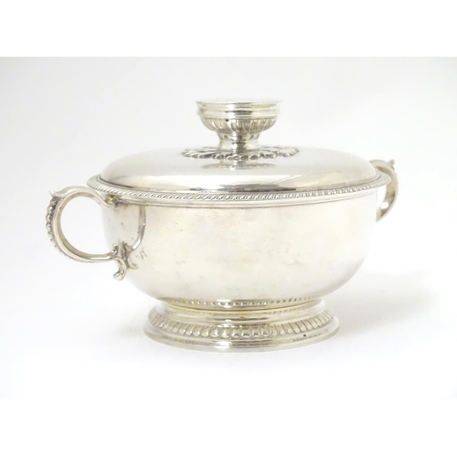 457 - A silver porringer and cover hallmarked London 1964, maker Edward Barnard & Sons Ltd. 
6 1/4