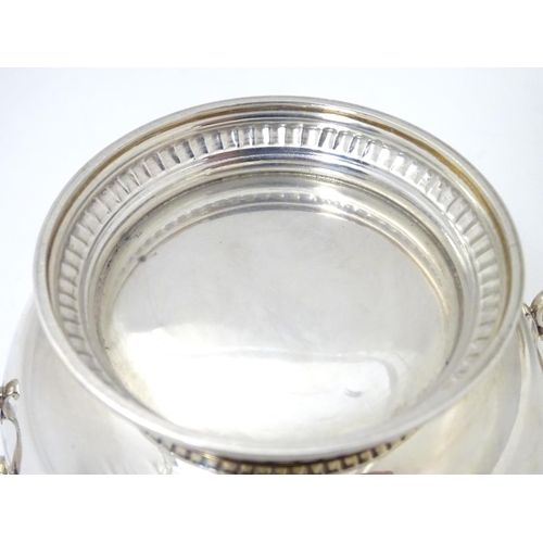 457 - A silver porringer and cover hallmarked London 1964, maker Edward Barnard & Sons Ltd. 
6 1/4