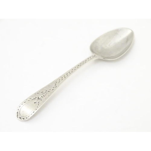 461 - A George III silver teaspoon with bright cut decoration, hallmarked London 1797.4 1/2