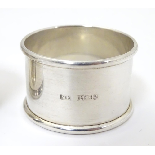 472 - Two silver napkin rings, one hallmarked London 1844, the other Birmingham 1986 (2)