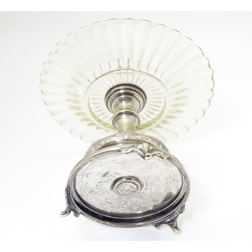 476 - A late 19thC / early 20thC silver plate and glass centre piece with provision for epergne glass flut... 