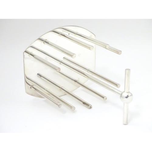 477 - A late 20thC Silver plated toast / letter rack made to a design by Christopher Dresser. 6 1/2