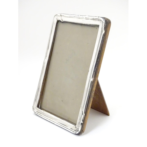 481 - A photograph frame with silver surround hallmarked Birmingham 1923 maker A & J Zimmerman Ltd (Arthur... 