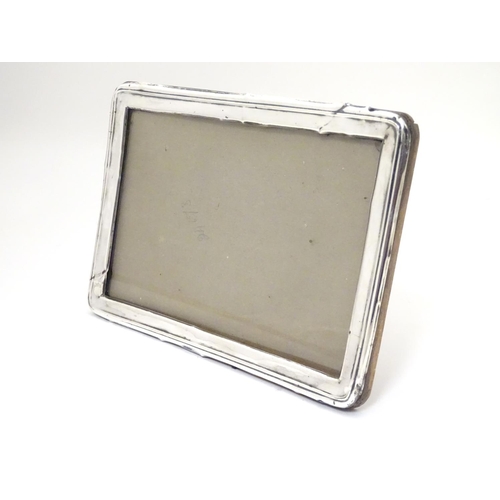 481 - A photograph frame with silver surround hallmarked Birmingham 1923 maker A & J Zimmerman Ltd (Arthur... 