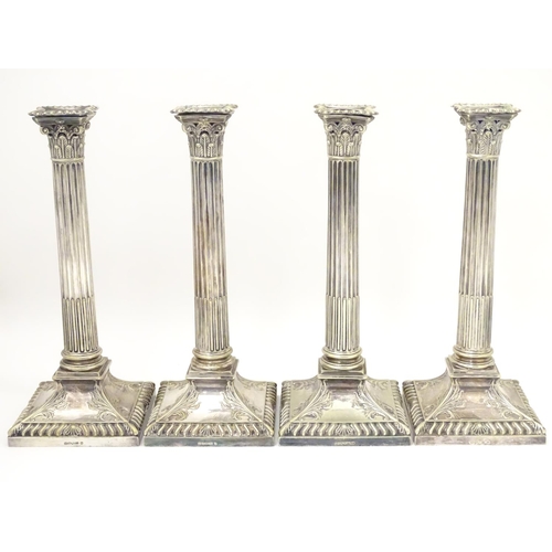 484 - A set of 4 silver plate Corinthian column candlesticks with acanthus detail . Approx 11