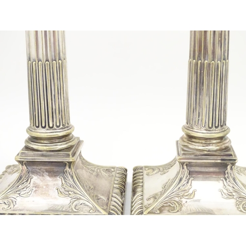 484 - A set of 4 silver plate Corinthian column candlesticks with acanthus detail . Approx 11