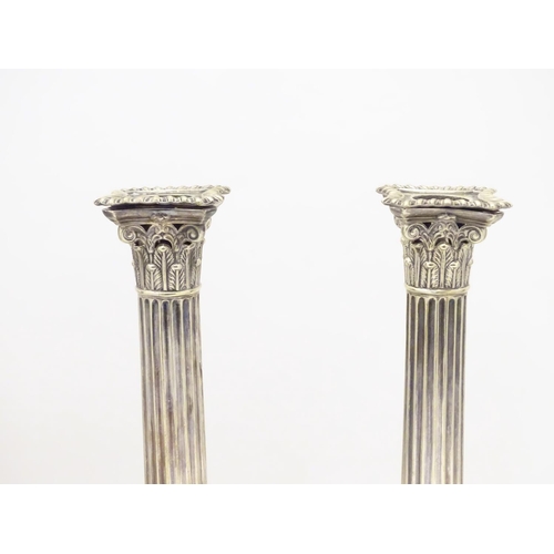 484 - A set of 4 silver plate Corinthian column candlesticks with acanthus detail . Approx 11