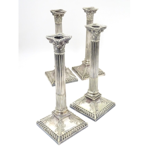 484 - A set of 4 silver plate Corinthian column candlesticks with acanthus detail . Approx 11