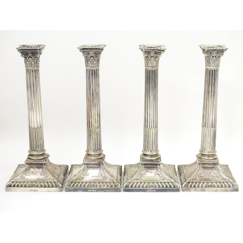 484 - A set of 4 silver plate Corinthian column candlesticks with acanthus detail . Approx 11