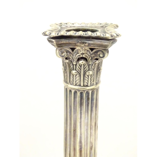 484 - A set of 4 silver plate Corinthian column candlesticks with acanthus detail . Approx 11