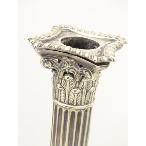 484 - A set of 4 silver plate Corinthian column candlesticks with acanthus detail . Approx 11