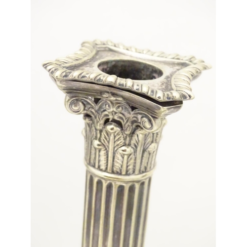 484 - A set of 4 silver plate Corinthian column candlesticks with acanthus detail . Approx 11