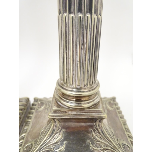 484 - A set of 4 silver plate Corinthian column candlesticks with acanthus detail . Approx 11