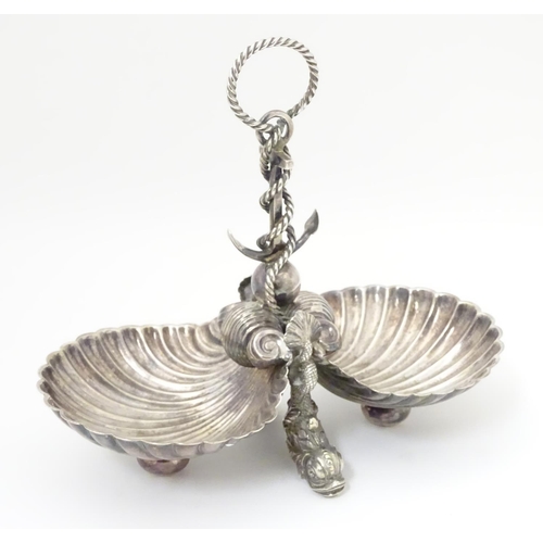 485 - A late 19thC / early silver plate dish with twin scallop shell formed bowls united by an anchor and ... 