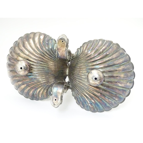 485 - A late 19thC / early silver plate dish with twin scallop shell formed bowls united by an anchor and ... 