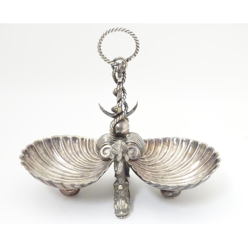 485 - A late 19thC / early silver plate dish with twin scallop shell formed bowls united by an anchor and ... 