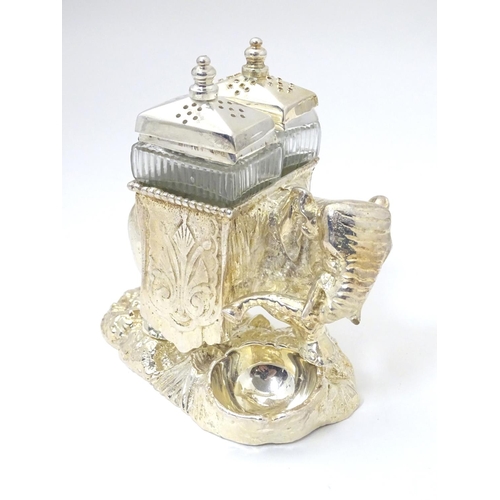 487 - A late 20thC / 21stC novelty cruet formed as  as an elephant carrying pepperettes. Approx 4 1/4