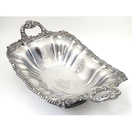 489 - A 19thC silver plate pedestal dish with twin handles and  engraved coat of arms to centre with motto... 