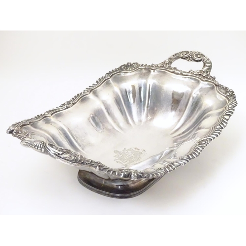 489 - A 19thC silver plate pedestal dish with twin handles and  engraved coat of arms to centre with motto... 