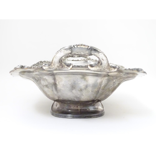 489 - A 19thC silver plate pedestal dish with twin handles and  engraved coat of arms to centre with motto... 