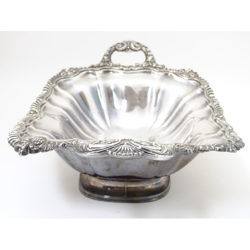 489 - A 19thC silver plate pedestal dish with twin handles and  engraved coat of arms to centre with motto... 